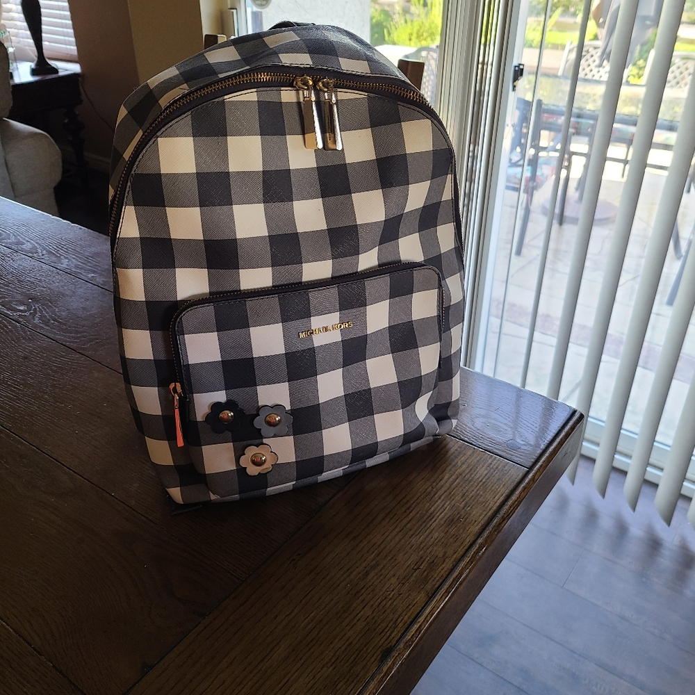 Back To School In Style.Michael Kors check backpack with leather flowers.